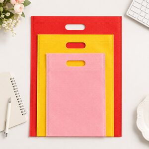 non-woven die-cut handle bags in red yellow pink for retail businesses